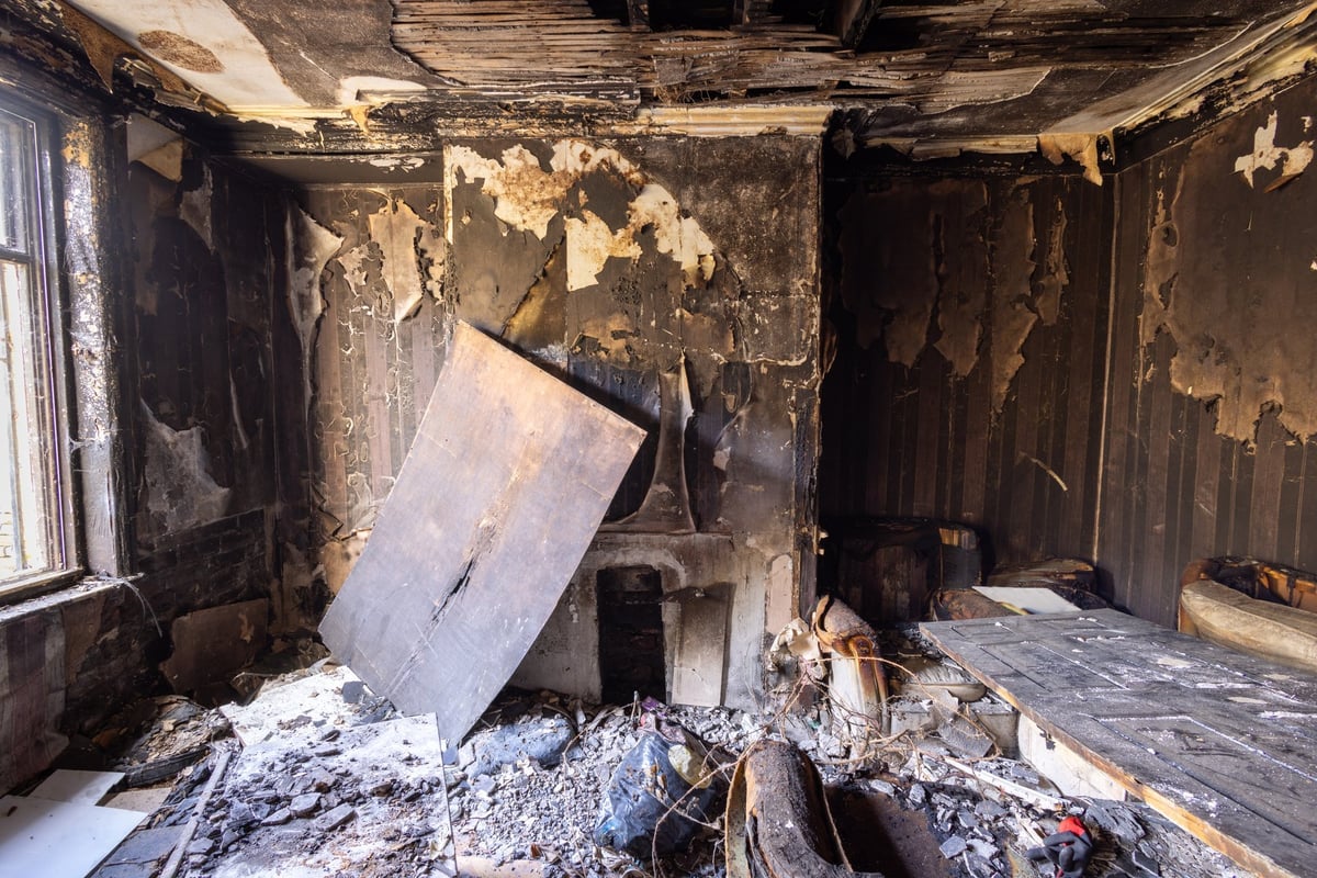 Fire damaged living room with burnt walls